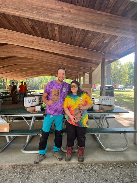 Joe Schulz and Zoe Ruiz standing together.